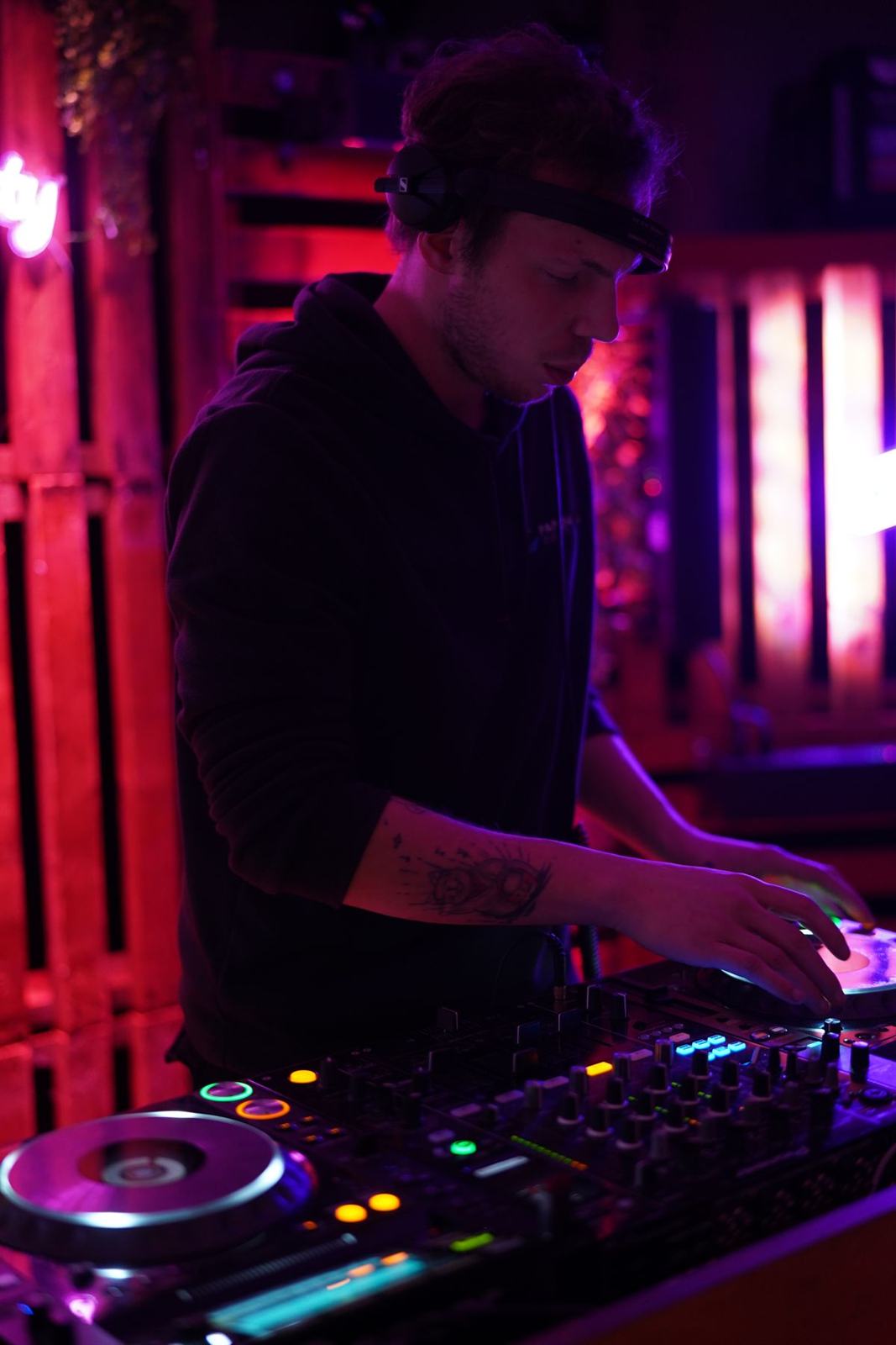 Milo at the decks in red light